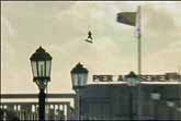 Kite Surfers Jump Over Pier