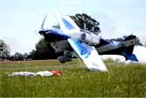 Low-Flying Plane Picks Up Flags From Ground