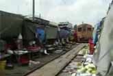 Train Drives Through Market