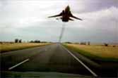 Russian Su-24 Fighter Jet Buzzes Highway Drivers