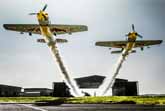 Two Planes Fly Through a Hangar