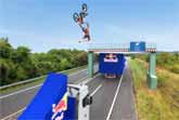 World First: Motorbike Backflip Between Two Moving Trucks